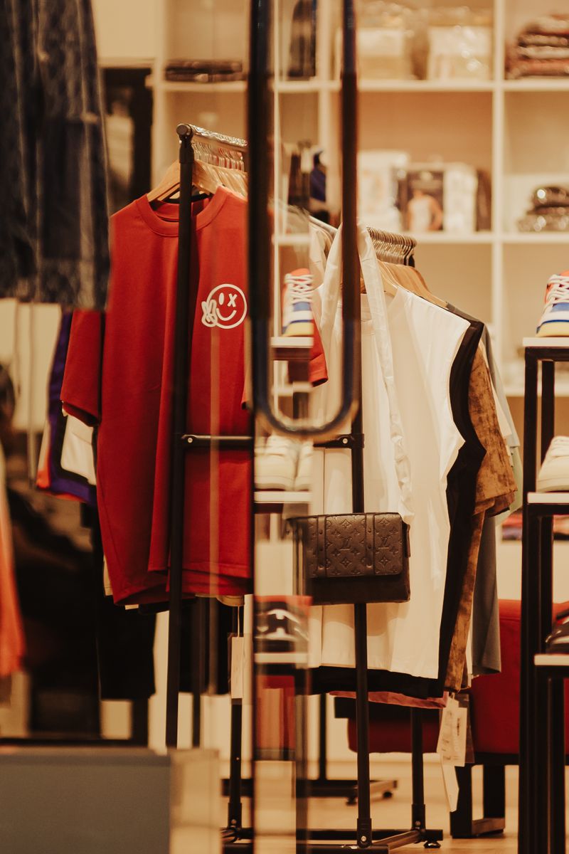 Stylish interior of a modern clothing store featuring a variety of colorful apparel and accessories.